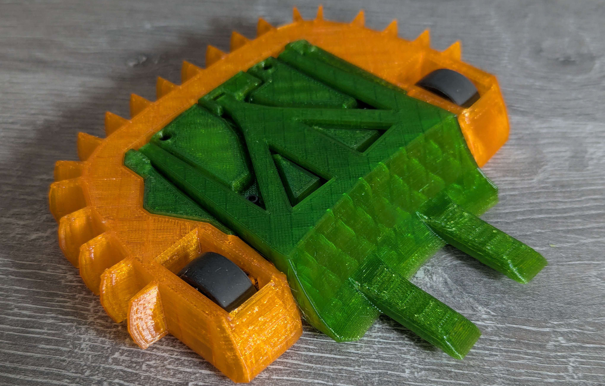 A photo of EF1, the robot has a green chassis and orange outer bumper case